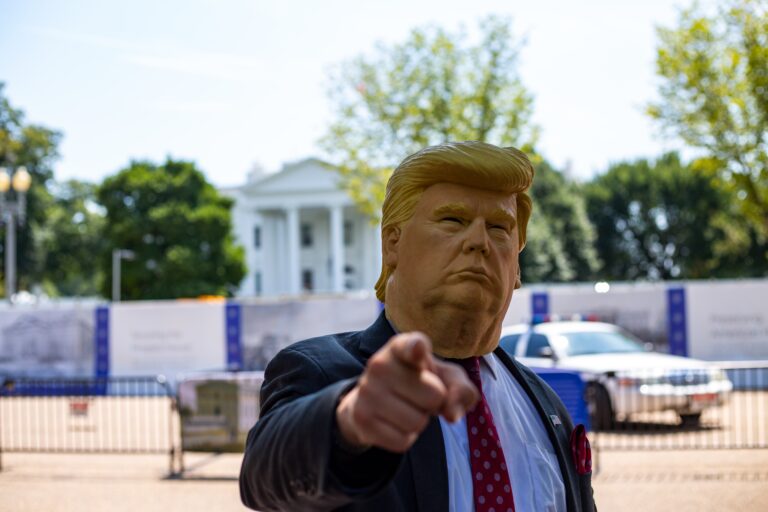 Presidents-man-wearing-donald-trump-mask-standing-in-front-of-white-house.jpg